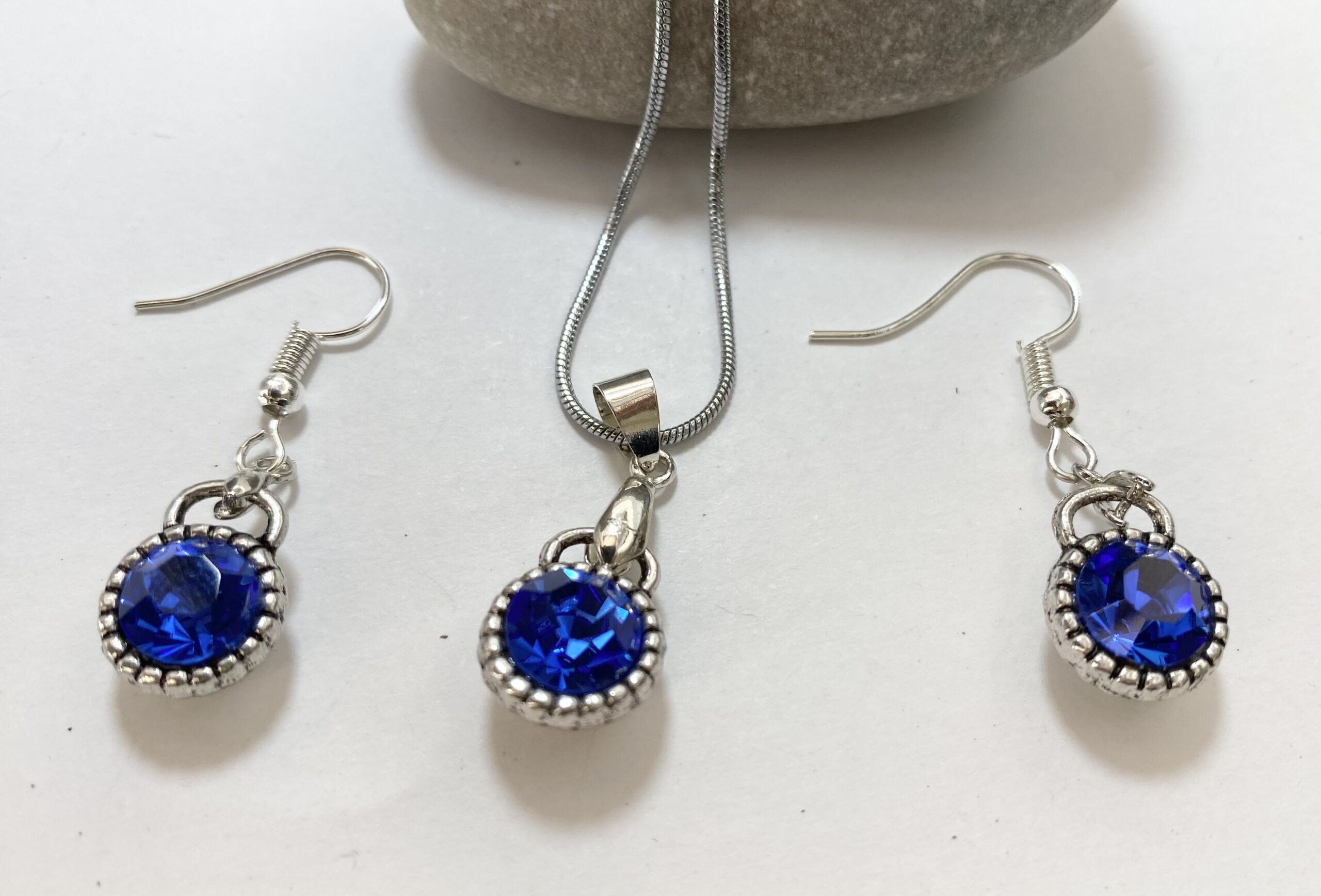 Set - 18k White Gold Plated Set of Earrings and Necklace With Synthetic Blue Sapphires #ML1230 R695.00 | Dimensions: Chain is 485mm. Earrings are 22mm x 11mm. Pendant is 28mm x 11mm - Image 2