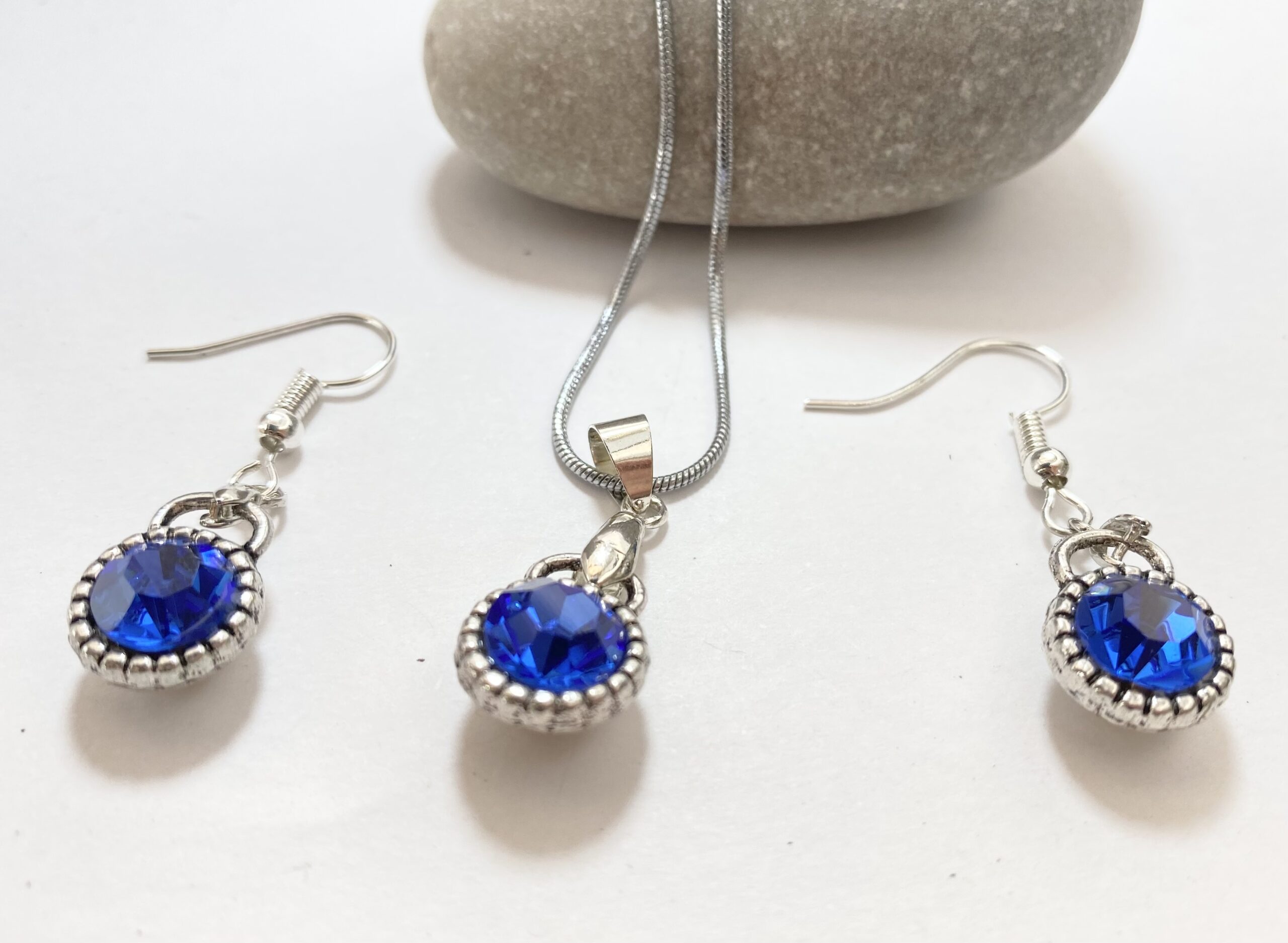 Set - 18k White Gold Plated Set of Earrings and Necklace With Synthetic Blue Sapphires #ML1230 R695.00 | Dimensions: Chain is 485mm. Earrings are 22mm x 11mm. Pendant is 28mm x 11mm