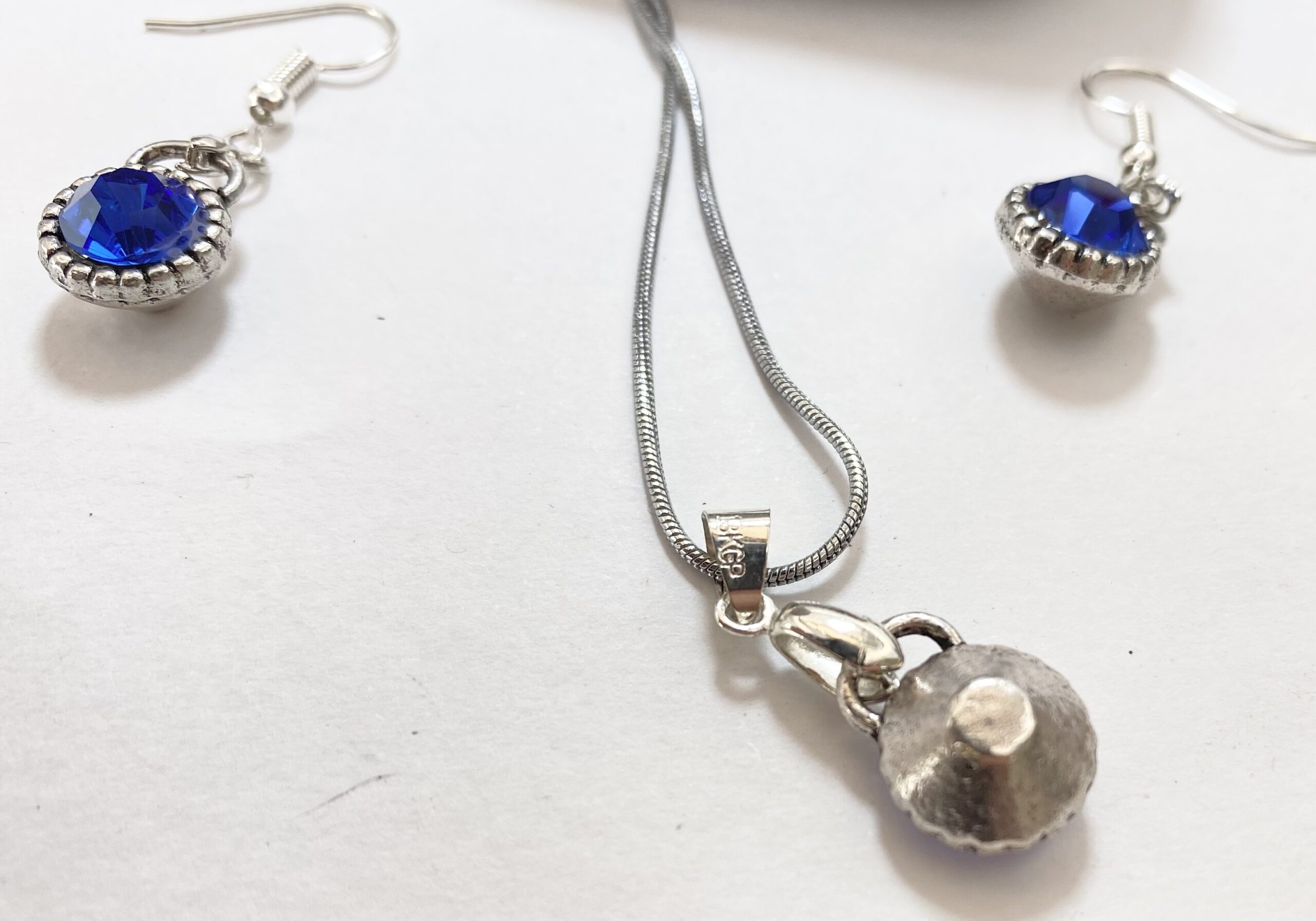 Set - 18k White Gold Plated Set of Earrings and Necklace With Synthetic Blue Sapphires #ML1230 R695.00 | Dimensions: Chain is 485mm. Earrings are 22mm x 11mm. Pendant is 28mm x 11mm - Image 4