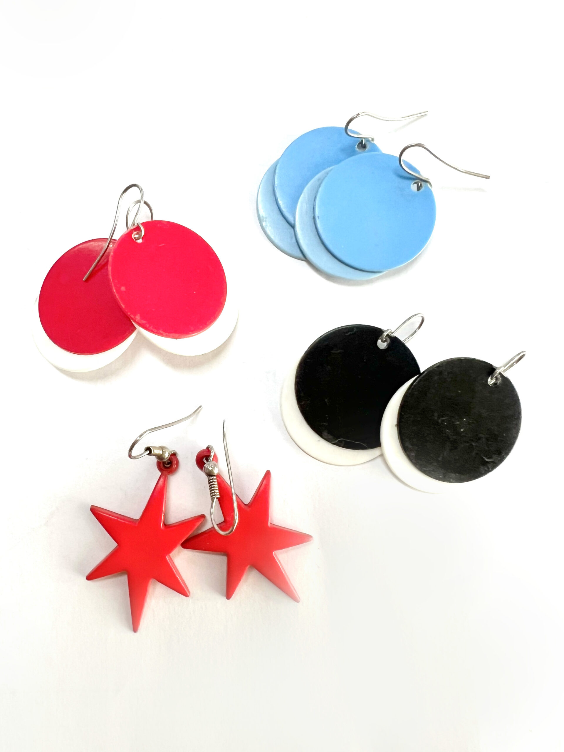 Earrings - For Pierced Ears. 4x Pair of Party Earrings. 1 x Round Blue. 1x Round Red& White. 1x Round Black & White. 1 x Red Stars ML1875